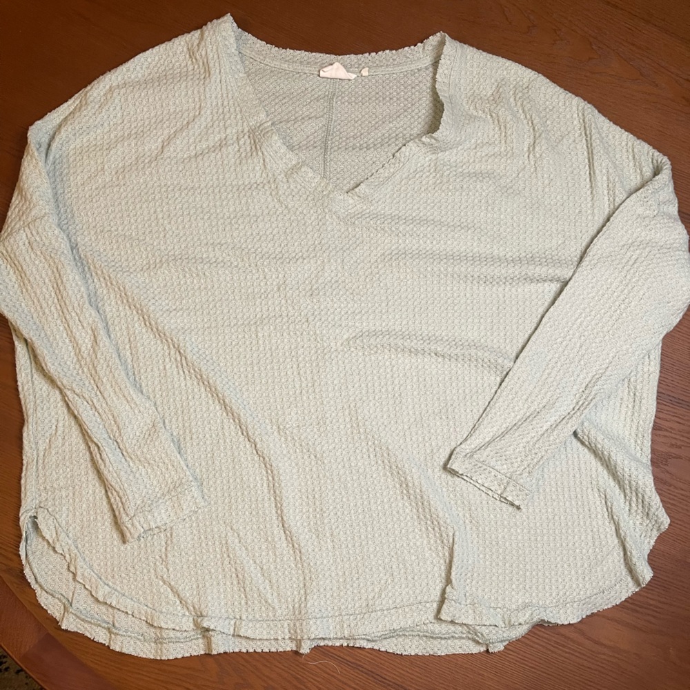 Mint colored knit top.